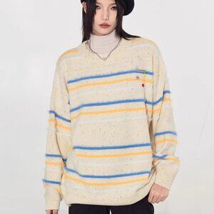 Striped contrasting crew-neck knitwear sweater buttons over a loose top